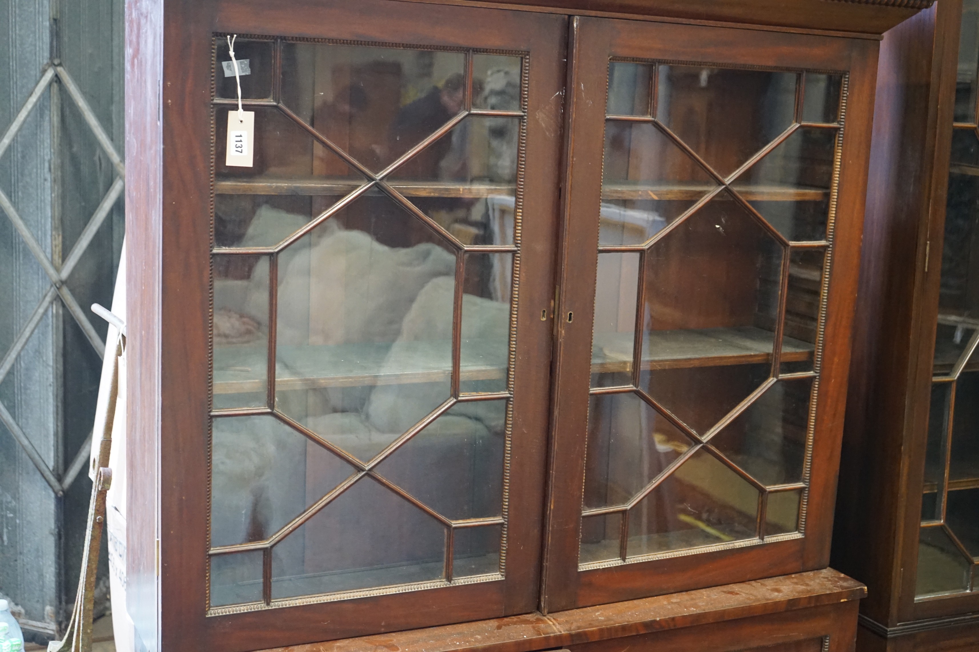 A Victorian mahogany glazed bookcase, width 126cm, depth 34cm, height 169cm